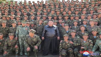 North Korean leader Kim Jong Un posing with troops. File image/ AFP 