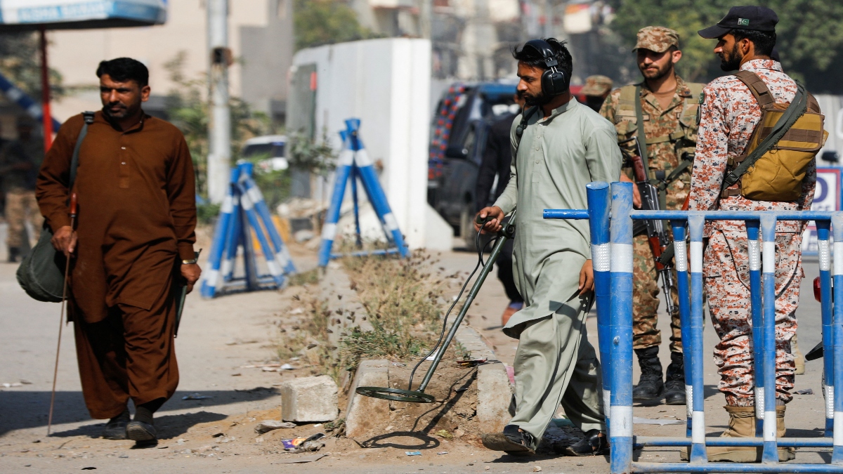 Members of the bomb disposal squad in plain clothes, survey the area after attack on a police station, in Karachi, Pakistan, on February 18, 2023. Reuters File Members of the bomb disposal squad in plain clothes, survey the area after attack on a police station, in Karachi, Pakistan, on February 18, 2023. Reuters File