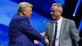 Robert F Kennedy Jr and Republican presidential nominee and former US President Donald Trump greet each other at a campaign event in Duluth, Georgia, US, October 23, 2024. File Image/Reuters