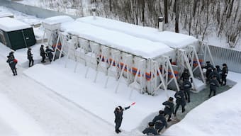Emergency personnel walk into radiation-resistant mobile bomb shelters in Nizhny Novgorod region, Russia, on February 10, 2023. Reuters File
