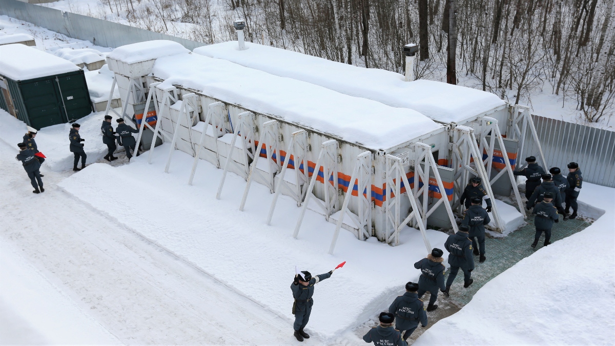 Emergency personnel walk into radiation-resistant mobile bomb shelters in Nizhny Novgorod region, Russia, on February 10, 2023. Reuters File Emergency personnel walk into radiation-resistant mobile bomb shelters in Nizhny Novgorod region, Russia, on February 10, 2023. Reuters File