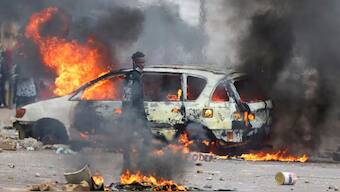 A protester looks on near a burning barricade during a "national shutdown" against the election outcome, in Maputo, Mozambique, November 7, 2024.- Image- Reuters 