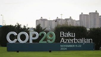 A view shows a sign of the COP29 United Nations Climate Change Conference with a backdrop of the cityscape in Baku, Azerbaijan October 31, 2024. Image- Reuters