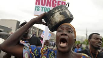A woman protest against hardship on the street of Lagos this year. Thousands of mostly young people poured onto the streets across Nigeria as they protested against the country's worst cost-of-living crisis in a generation.