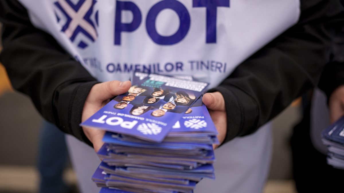 A man distributes leaflets of the Young People's Party or POT, which has backed Calin Georgescu, an independent candidate who won the first round of presidential elections, in Bucharest, Romania. AP A man distributes leaflets of the Young People's Party or POT, which has backed Calin Georgescu, an independent candidate who won the first round of presidential elections, in Bucharest, Romania. AP