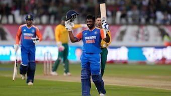 Sanju Samson celebrates scoring his century against South Africa in Durban on Friday. AP 