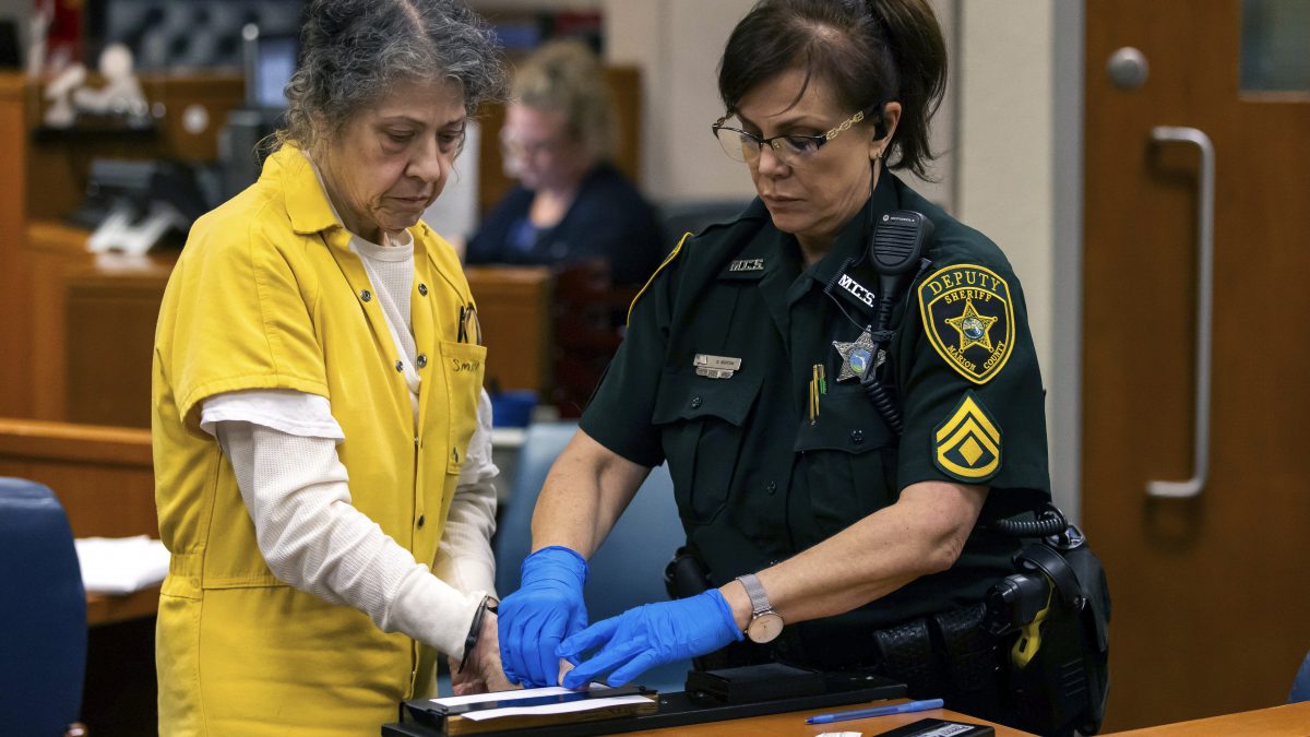Susan Lorincz, left, who fatally shot a Black neighbour through her front door during an ongoing dispute, is finger printed after she was sentenced to 25 years in prison at a court hearing. AP Susan Lorincz, left, who fatally shot a Black neighbour through her front door during an ongoing dispute, is finger printed after she was sentenced to 25 years in prison at a court hearing. AP