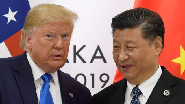 In this file image former US President Donald Trump poses for a photo with Chinese President Xi Jinping during a meeting on the sidelines of the G-20 summit in Osaka, western Japan. AP