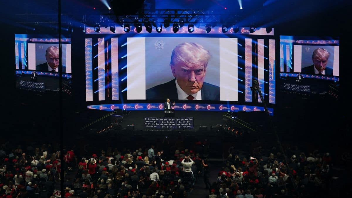 The mugshot of Republican presidential nominee and former US President Donald Trump is displayed on screens at a campaign event in Duluth, Georgia, US, October 23, 2024. File Image/Reuters