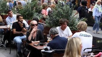 A woman smokes outside a pub at Covent Garden in London, UK, August 29, 2024. File Image/Reuters