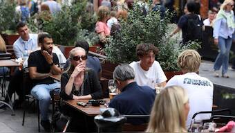 A woman smokes outside a pub at Covent Garden in London, UK, August 29, 2024. File Image/Reuters