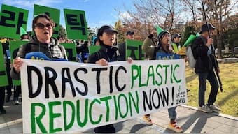 Climate activists march on a street to demand stronger global commitments to fight plastic waste. Image used for representative purpose/Reuters