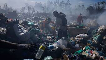 Recyclable collectors work at the Lixao open-air dump in Santo Antonio do Descoberto, Goias state, Brazil. AP/File Photo
