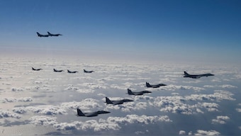 This handout photo taken on November 3, 2024 and provided by the US Air Force via South Korean Defence Ministry shows a US Air Force B-1B bomber (R), South Korean Air Force F-15K fighter jets (bottom), Japanese Air Self-Defense Force F-2 fighter jets (L) and US Air Force F-16 fighter jets (top L) flying in formation during a joint air drill. AFP