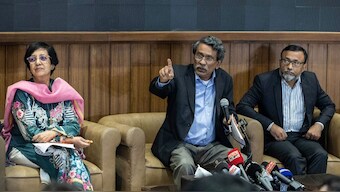 Ali Riaz (C), head of the Bangladesh's Constitutional Reform Commission, speaks during a press conference in Dhaka on November 3, 2024.  AFP