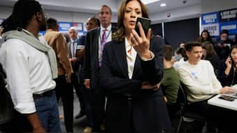 Democratic presidential nominee Vice President Kamala Harris phone banks with volunteers at the DNC headquarters on Election Day, November 5, 2024, in Washington. AP