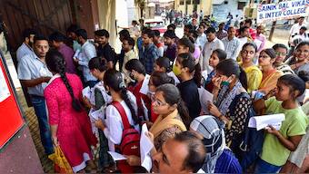 Aspirants arrive at an examination centre to appear for the Uttar Pradesh Public Service Commission's (UPPSC) PCS preliminary exam 2023, in Prayagraj, May 14, 2023. File Photo/PTI