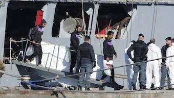 Migrants disembark from the Italian navy ship Libra at the port of Shengjin, northwestern Albania, Friday, Nov. 8, 2024, as a second group of eight migrants intercepted in international waters is processed in a reception facility despite the failure with the first group in October.(AP Photo)