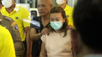 Sararat Rangsiwuthaporn is seen escorted by police officers at a police station in Bangkok, Thailand, April 26, 2023. Reuters/File Image
