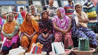 Construction workers waiting unsuccessfully for work near the Mirpur bridge in Dhaka, Bangladesh. Source: Reuters | FILE.