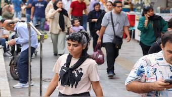 People walk on a market street in Tehran on September 15, 2024, on the second anniversary of a protest movement sparked by the death in custody of Mahsa Amini, 22, arrested for allegedly violating the dress code for women. AFP/Representative image