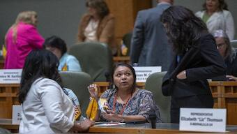 House Maj. Whip Reena Szczepanski, D-Santa Fe, left, Rep. D. Wonda Johnson, D-Church Rock, center, and Rep. Cristina Parajon, D-Albuquerque, talk before the start of a special session, in Santa Fe, N.M., July 18, 2024.
