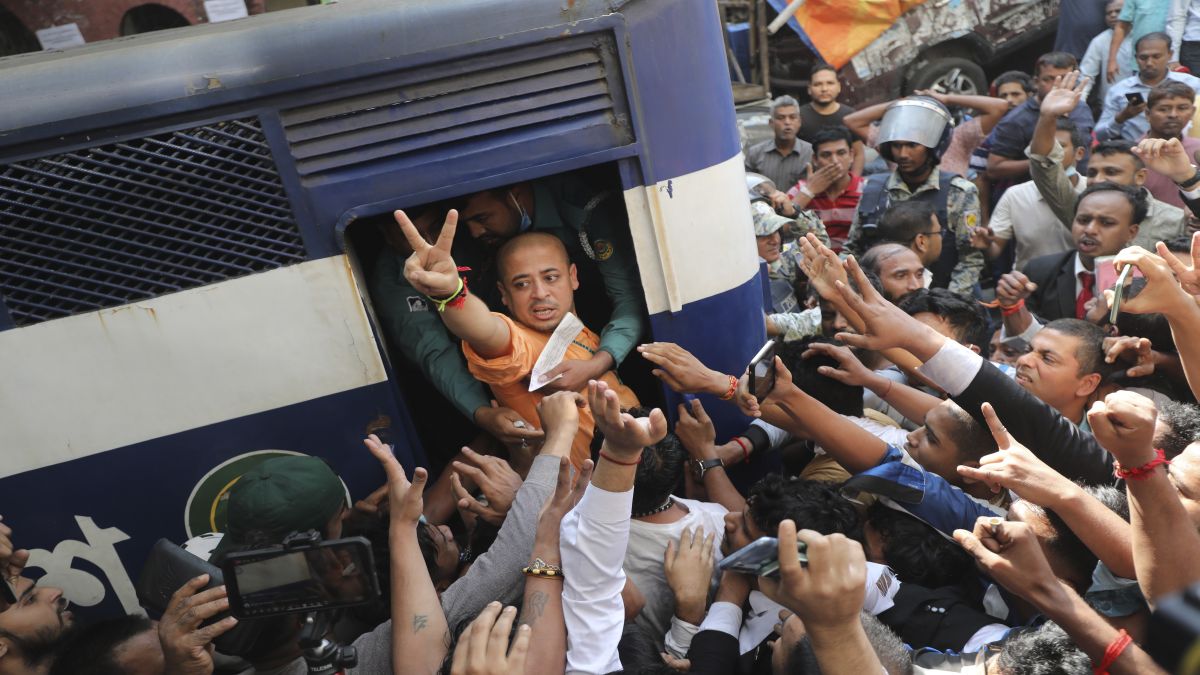 Bangladeshi Hindu leader Krishna Das Prabhu shows a victory sign as he is taken in a police van after a court denied him bail. Protests have gripped the country over the last two days. AP Bangladeshi Hindu leader Krishna Das Prabhu shows a victory sign as he is taken in a police van after a court denied him bail. Protests have gripped the country over the last two days. AP