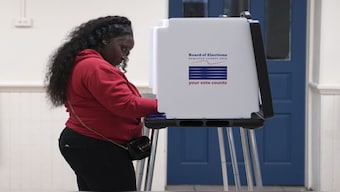 A voter casts a ballot on Election Day at the Church of Our Savior in the Mount Auburn neighbourhood of Cincinnati. AP