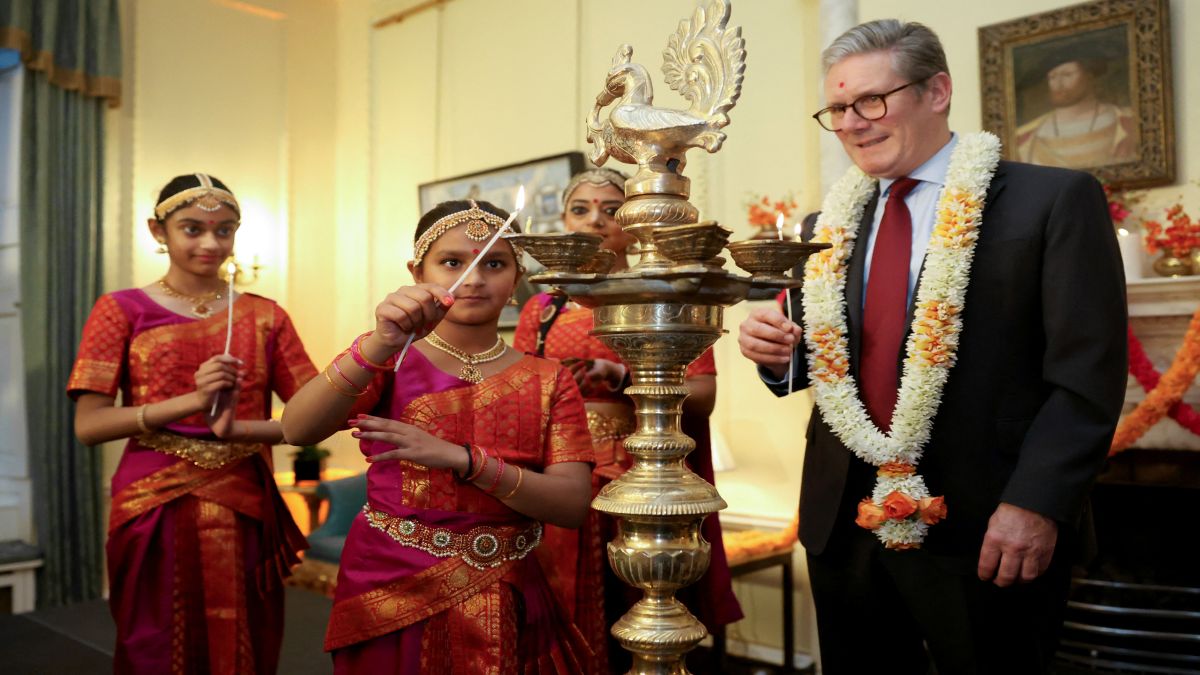 Britain's Prime Minister Keir Starmer and members of the Arunima Kumar Dance Company hold candles to light a lamp during a reception at 10 Downing Street to celebrate Diwali in London, Britain. Reuters Britain's Prime Minister Keir Starmer and members of the Arunima Kumar Dance Company hold candles to light a lamp during a reception at 10 Downing Street to celebrate Diwali in London, Britain. Reuters