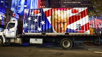 A truck displays a picture Republican presidential nominee, former U.S. President Donald Trump as supporters gather at Rockefeller Center in New York City. AFP