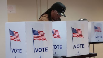 A person votes during early voting in the US presidential election at a polling station in Detroit, Michigan, November 3, 2024. Reuters
