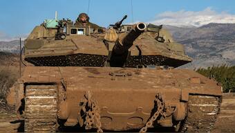 An Israeli soldier manoeuvres a tank, amid cross-border hostilities between Hezbollah and Israel, by Israel's border with Lebanon in northern Israel. Under the ceasefire, Israel will withdraw its forces from Lebanon over a period of 60 days. Reuters