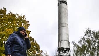 A woman walks her pet in front of a Soviet R-9A intercontinental ballistic missile (ICBM) next to the central Museum of Russia's Armed Forces in Moscow. Image used for representative purpose/AFP