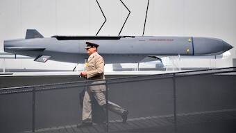A member of the military walks past a MBDA Storm Shadow/Scalp missile at the Farnborough Airshow, south west of London. On Wednesday, Ukraine fired British-made Storm Shadow cruise missiles at targets inside Russia for the first time. File image/AFP