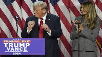 Republican Presidential nominee former President Donald Trump dances as former first lady Melania Trump watches at the Palm Beach County Convention Center during an election night watch party, Wednesday in Florida after he won the US presidency. AP