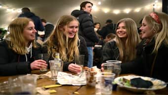 People enjoy a evening at a pub in London, Britain. Owing to a spike in cases of drink spiking, the UK government is now mulling into making it a standalone criminal offence. Representational image/Reuters