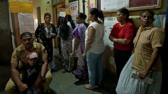 Women queue to cast their votes at a polling station during the Maharashtra state elections, in Mumbai, India, November 20, 2024. File Image/Reuters