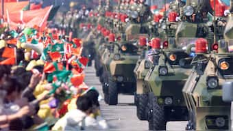 Macau residents greet People's Liberation Army (PLA) soldiers December 20, 1999, as they enter the former Portuguese colony. Reuters