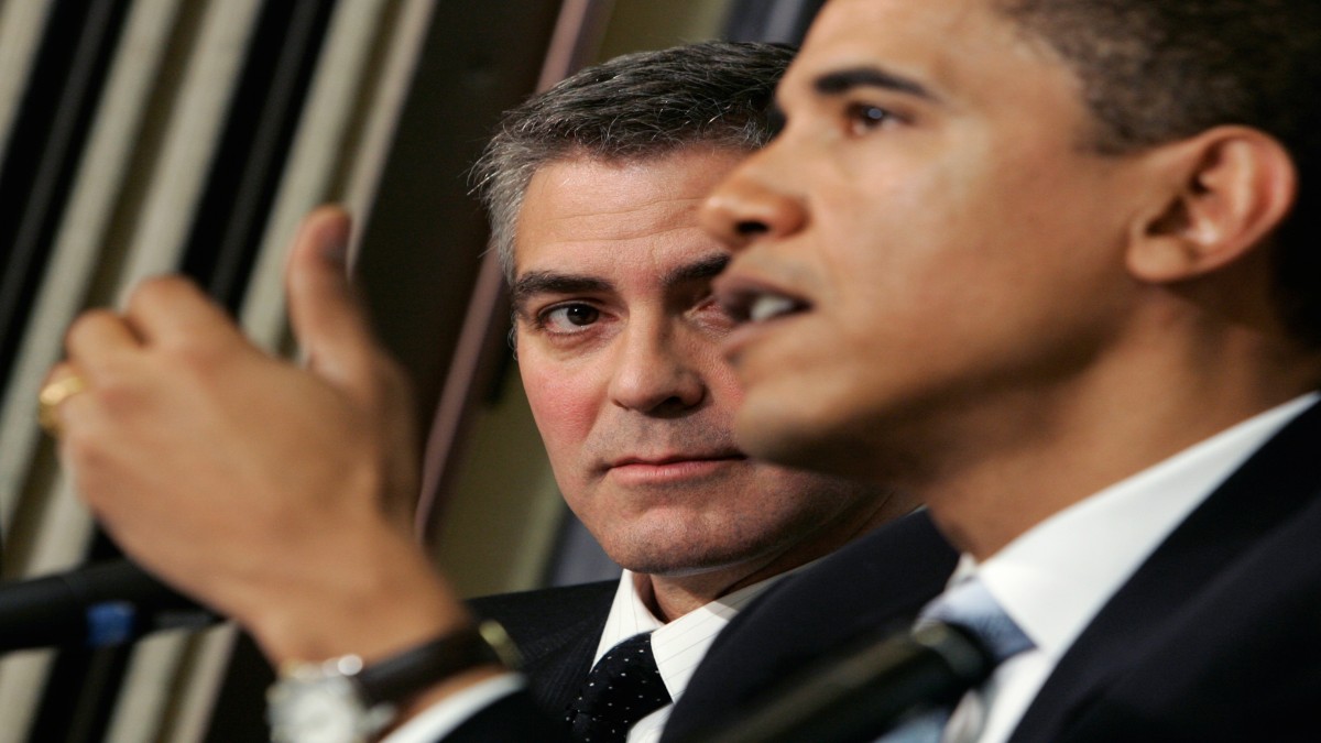 Academy awarding-winning actor George Clooney (L) looks on as Senator Barack Obama (D-IL) speaks about the Darfur region of Sudan, in Washington, April 27, 2006. Reuters Academy awarding-winning actor George Clooney (L) looks on as Senator Barack Obama (D-IL) speaks about the Darfur region of Sudan, in Washington, April 27, 2006. Reuters
