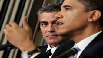 Academy awarding-winning actor George Clooney (L) looks on as Senator Barack Obama (D-IL) speaks about the Darfur region of Sudan, in Washington,  April 27, 2006. Reuters