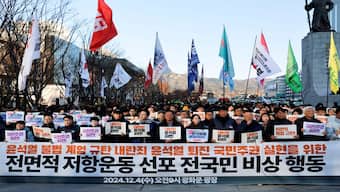 People take part in a rally to demand South Korean President Yoon Suk Yeol's removal from power, in Seoul, South Korea, December 4, 2024.  Reuters