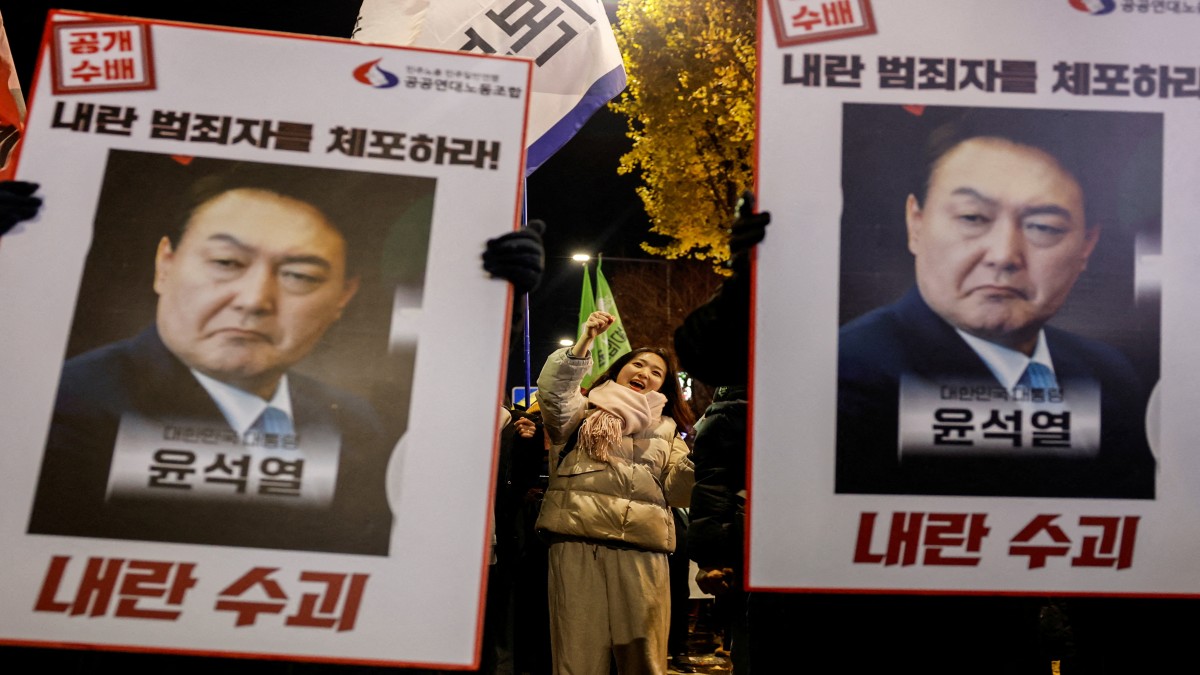 Protesters hold placards during a candlelight vigil to condemn South Korean President Yoon Suk Yeol's surprise declarations of the failed martial law and to call for his resignation in Seoul, South Korea, December 5, 2024. Reuters Protesters hold placards during a candlelight vigil to condemn South Korean President Yoon Suk Yeol's surprise declarations of the failed martial law and to call for his resignation in Seoul, South Korea, December 5, 2024. Reuters