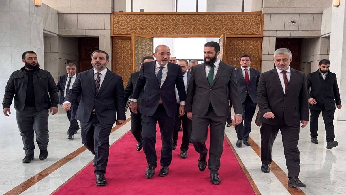 Jordan's Foreign Minister Ayman Safadi (C-L) being received by Hayat Tahrir al-Sham (HTS) leader Ahmed al-Sharaa (also known as Abu Mohammad al-Jolani) (C-R) in Damascus on December 23, 2024. AFP Jordan's Foreign Minister Ayman Safadi (C-L) being received by Hayat Tahrir al-Sham (HTS) leader Ahmed al-Sharaa (also known as Abu Mohammad al-Jolani) (C-R) in Damascus on December 23, 2024. AFP