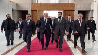 Jordan's Foreign Minister Ayman Safadi (C-L) being received by Hayat Tahrir al-Sham (HTS) leader Ahmed al-Sharaa (also known as Abu Mohammad al-Jolani) (C-R) in Damascus on December 23, 2024. AFP