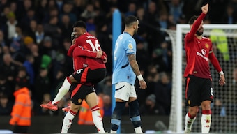 Manchester United winger Amad Diallo celebrates with teammates after scoring the winner against Manchester City at the Etihad Stadium in their Premier League derby clash on Sunday, 15 December. Reuters