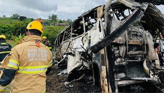Firefighters and other rescue teams work on the site of the bus crash in Teofilo Otoni, Minas Gerais state, Brazil. AFP