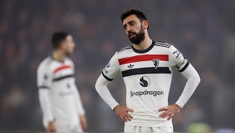 Manchester United's Bruno Fernandes wears a dejected look after being shown the red card during the away Premier League match against Wolverhampton Wanderers at the Molineux Stadium. Reuters