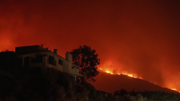 California firefighters battle three-alarm bushfire in Malibu, thousands face power outage