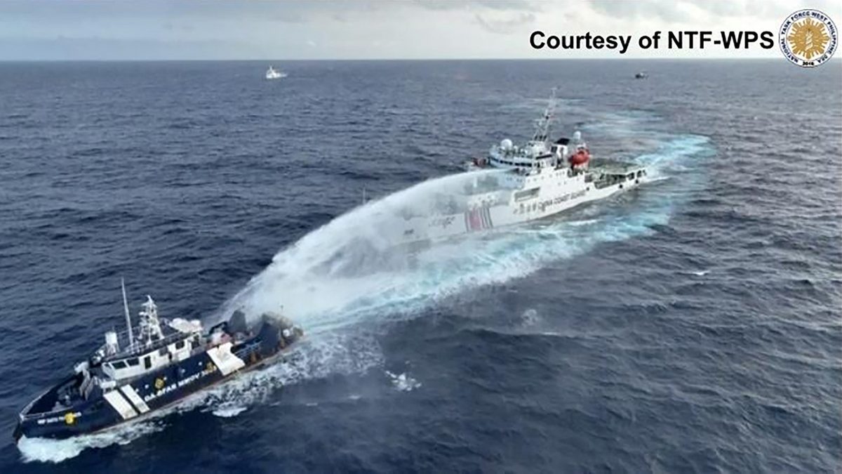 This handout taken and released on December 4, 2024 by the National Task Force for the West Philippine Sea (NTF-WPS) shows a China Coast Guard ship (R) deploying water cannon at the Phillipine Bureau of Fisheries and Aquatic Resources (BFAR) vessel BRP Datu Pagbuaya (L) near Scarborough Shoal in disputed waters of the South China Sea. Handout / National Task Force for the West Philippine Sea (NTF-WPS) / AFP This handout taken and released on December 4, 2024 by the National Task Force for the West Philippine Sea (NTF-WPS) shows a China Coast Guard ship (R) deploying water cannon at the Phillipine Bureau of Fisheries and Aquatic Resources (BFAR) vessel BRP Datu Pagbuaya (L) near Scarborough Shoal in disputed waters of the South China Sea. Handout / National Task Force for the West Philippine Sea (NTF-WPS) / AFP