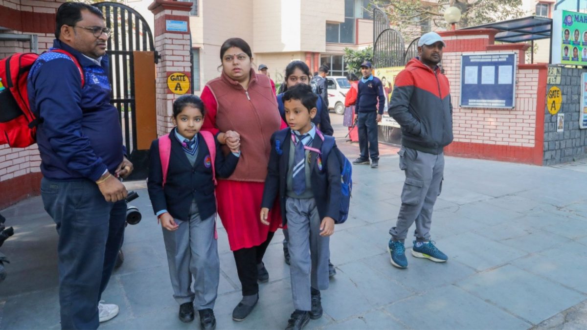 Students leave with their guardians after schools in Delhi received a bomb threat mail. Source: PTI. Students leave with their guardians after schools in Delhi received a bomb threat mail. Source: PTI.